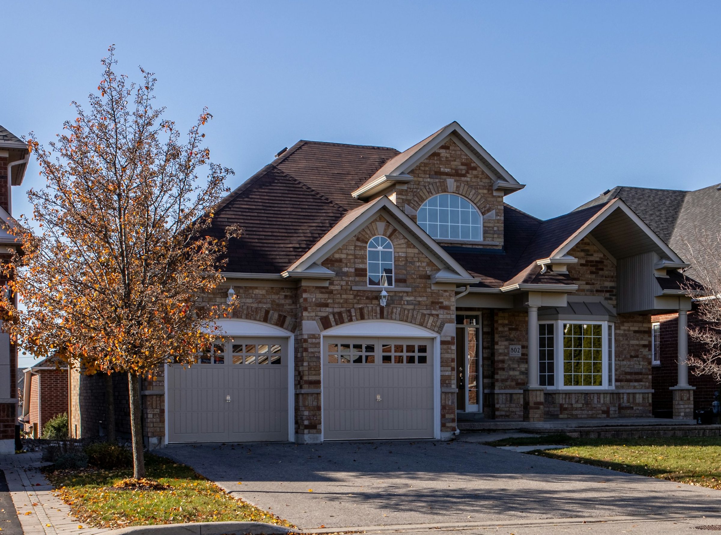 A stone-front home on a tree-lined street in the Philadelphia suburbs